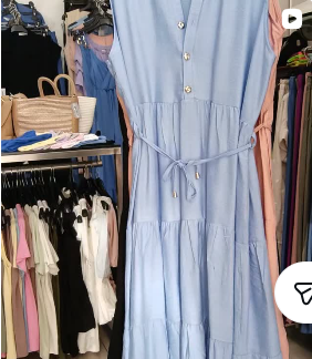 Blue tiered midi dress on a hanger at IMAJA